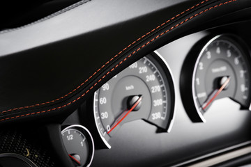 Close up shot of a speedometer in a car.