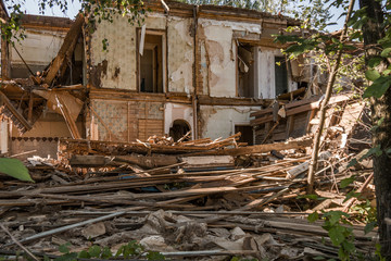 Old ruined wooden house. Two-story building intended for demolition.