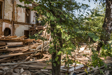 Old ruined wooden house. Two-story building intended for demolition.