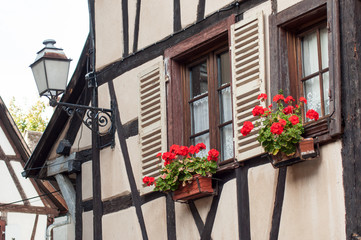 Fototapeta na wymiar retail of traditional medieval architecture in the alsatian village of Eguisheim near Colmar - France