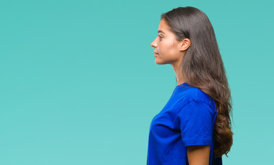 Young beautiful arab woman over isolated background looking to side, relax profile pose with natural face with confident smile.
