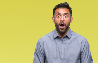 Adult hispanic man over isolated background afraid and shocked with surprise expression, fear and excited face.