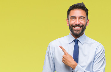Adult hispanic business man over isolated background cheerful with a smile of face pointing with...