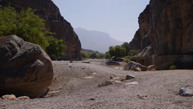 Tranquil canyon landscape scene in the countryside of the Sultanate of Oman.