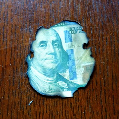 Center piece of burnt 100 dollar bill - burned franklin