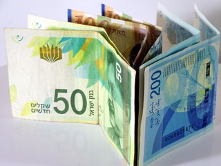Israeli shekels folded in half