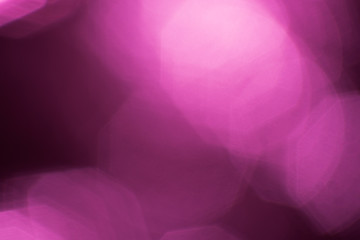Abstract blurred background with bokeh, light and dark magenta