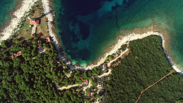 High aerial view of Veli Rat lighthouse and bay on island Dugi Otok in Croatia.