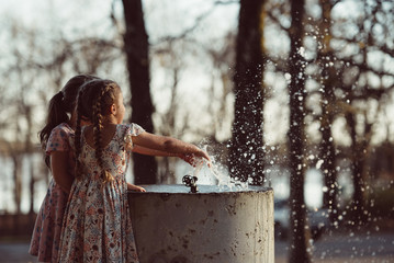 Children Play with Fountain Water
