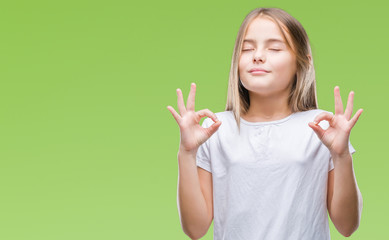 Young beautiful girl over isolated background relax and smiling with eyes closed doing meditation gesture with fingers. Yoga concept.