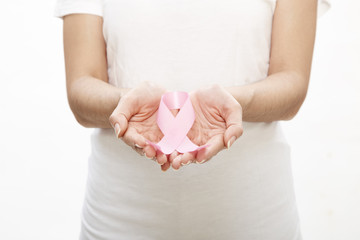 Woman holding a pink ribbon.