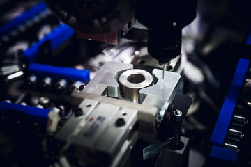 The CNC milling machine cutting the sample