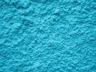 the wall is painted turquoise