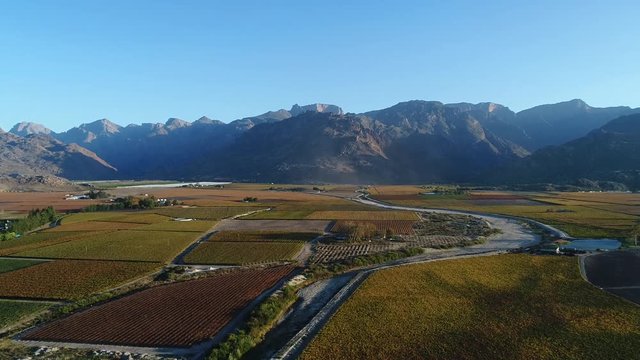 Stunning aerial views  over the hex river valley near the town of De Doorns in the Western Cape of South Africa during the Autumn season with amazing colors in the vineyards.