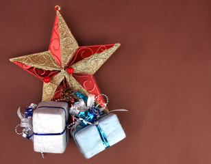 Brown background, gift box and Christmas decorations.