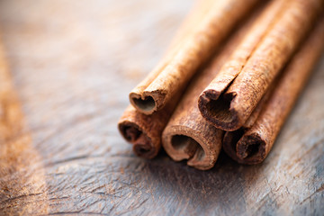Cinnamon sticks on wooden table, herb and spice, food ingredient
