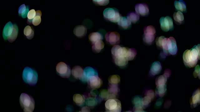 Abstract lights bokeh fly. Black backgrounds