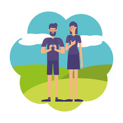 young couple using smartphone in landscape