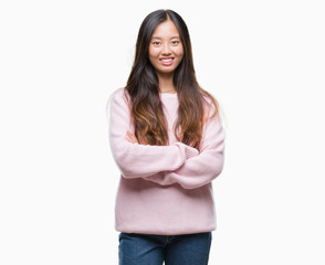 Fototapeta premium Young asian woman over isolated background happy face smiling with crossed arms looking at the camera. Positive person.