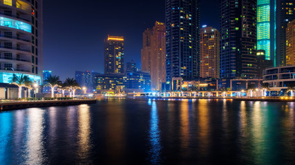 Fototapeta na wymiar Beautiful view to Dubai Marina, UAE. Long exposure time lapse effect at night