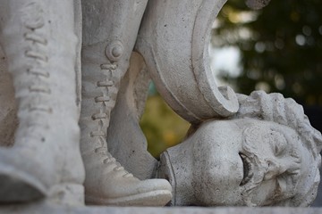 Statue of a soldier with a head at his feet in Madrid, Spain