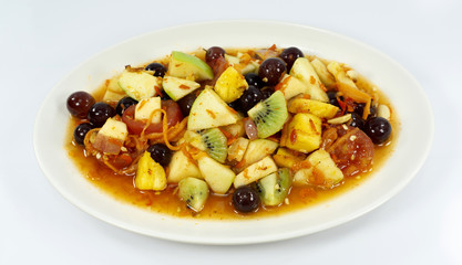 Fruits salad in Plate on white background, Healthy diet food concept. Top view, with copy space for your text..