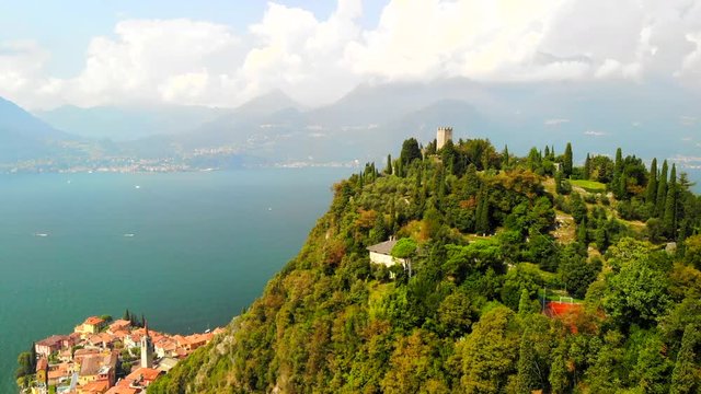 Drone shot of Varenna, Italy, with view of Lake Como and Castello di Vezio