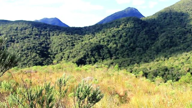 enjoying the view of the mountains in the middle of the hike, Paran&radic;&deg;, South Brazil on August 19, 2018.