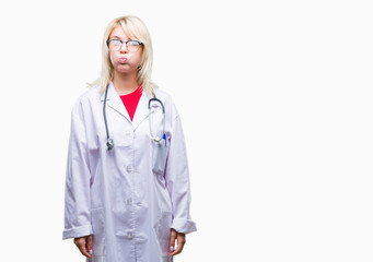 Young beautiful blonde doctor woman wearing medical uniform over isolated background puffing cheeks with funny face. Mouth inflated with air, crazy expression.