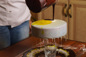 Cook preparing mousse cake Esterhazy. Girl fills dacquoise hazelnut almond hazelnut mousse. Home confectionery. Creating a pattern on glaze