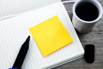 Design business Empty template isolated Minimalist graphic layout template for advertising . Marker over open notebook important yellow reminder cup coffee wooden table