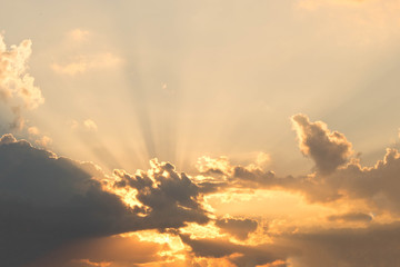 Evening sky with rays from behind the clouds. Sunlight coming from behind the clouds