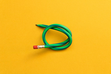 Naklejka premium Flexible pencil . Isolated on yellow background