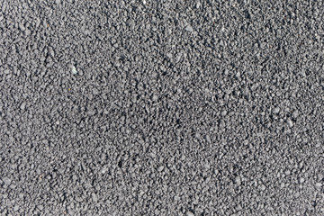Asphalt with big grain, top view, close up. Tarmac
