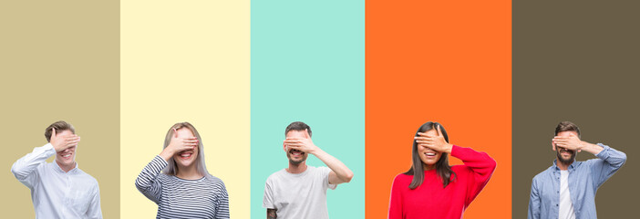 Fototapeta premium Collage of group of young people over colorful isolated background smiling and laughing with hand on face covering eyes for surprise. Blind concept.