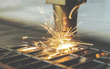 cutting parts on a laser machine with beautiful sparks