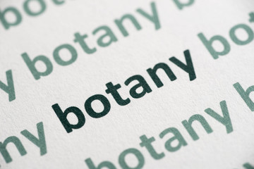 word botany printed on paper macro