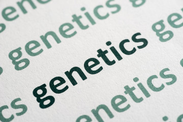 word genetics printed on paper macro