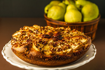 pear cake homemade pastries on a white dish on table.