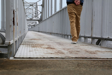 Man Crossing the Bridge