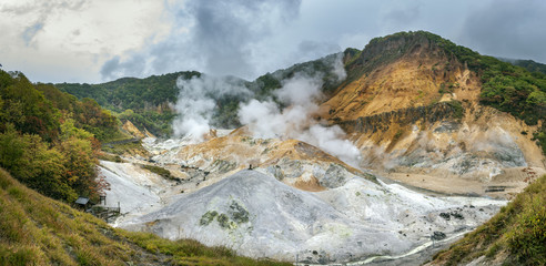 Naklejka na ściany i meble wide angle view of jigokudani hot spring valley in sapporo hokkaido one of most popular natural traveling destination