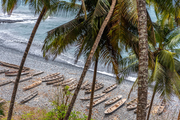 Boats on the beach, Palm tree fishing landscape of Sâo Tomé and Principe. Mountains like Pico...