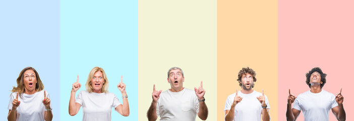 Fototapeta premium Collage of group of young and middle age people wearing white t-shirt over color isolated background amazed and surprised looking up and pointing with fingers and raised arms.