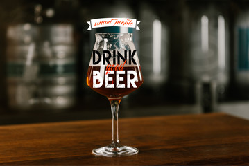 glass of fresh cold delicious beer on wooden table in pub with 