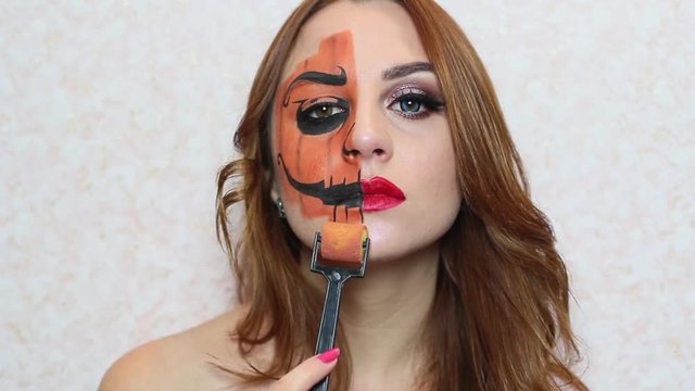 Halloween image, girl with halloween makeup, scary and beautiful face art