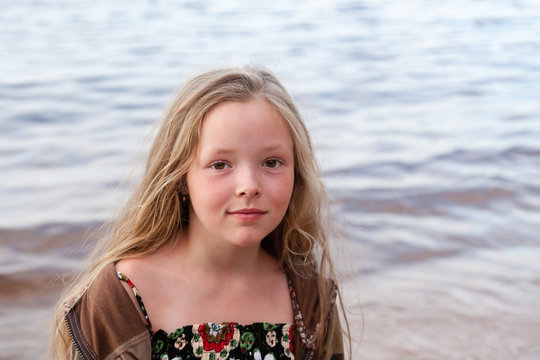 Portrait of a girl near the lake