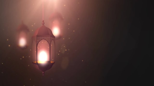 Ramadan candle lantern falling down hanging on string black background