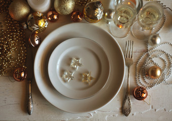 new years eve party table with champagne ,candles,tree decorations