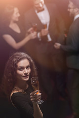 stylish young woman with glass of champagne