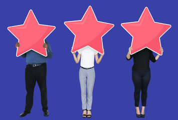 Diverse businesspeople showing a golden star rating symbol